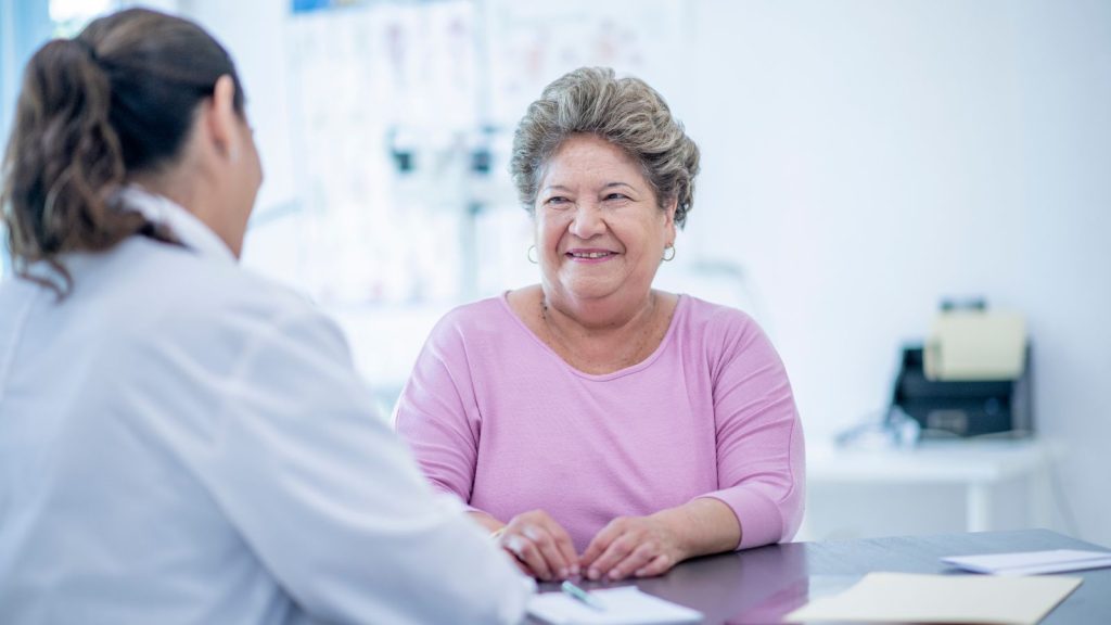 Image of patient speaking to doctor.