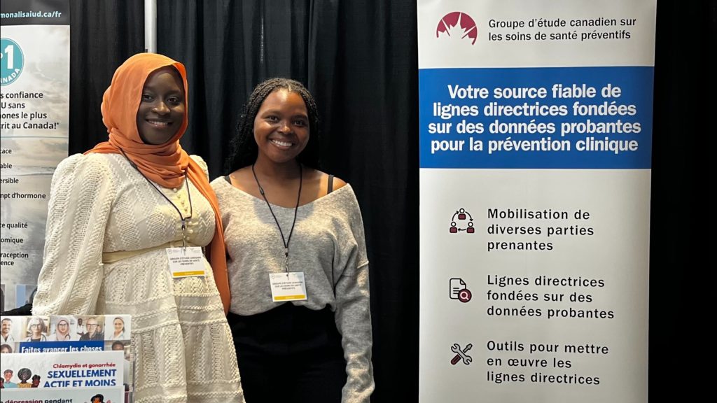 Photo of Task Force representatives Théodora and Mame Awa at the conference.